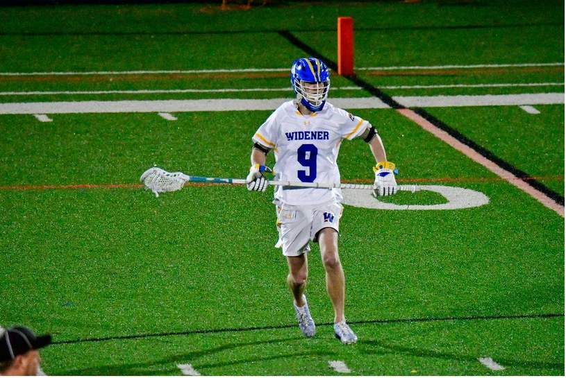 Cole playing lacrosse
