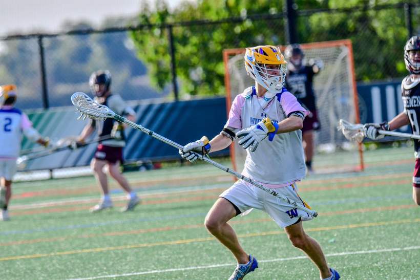 Cole playing lacrosse