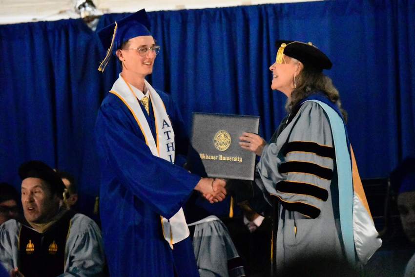 Cole crossing the stage at graduation